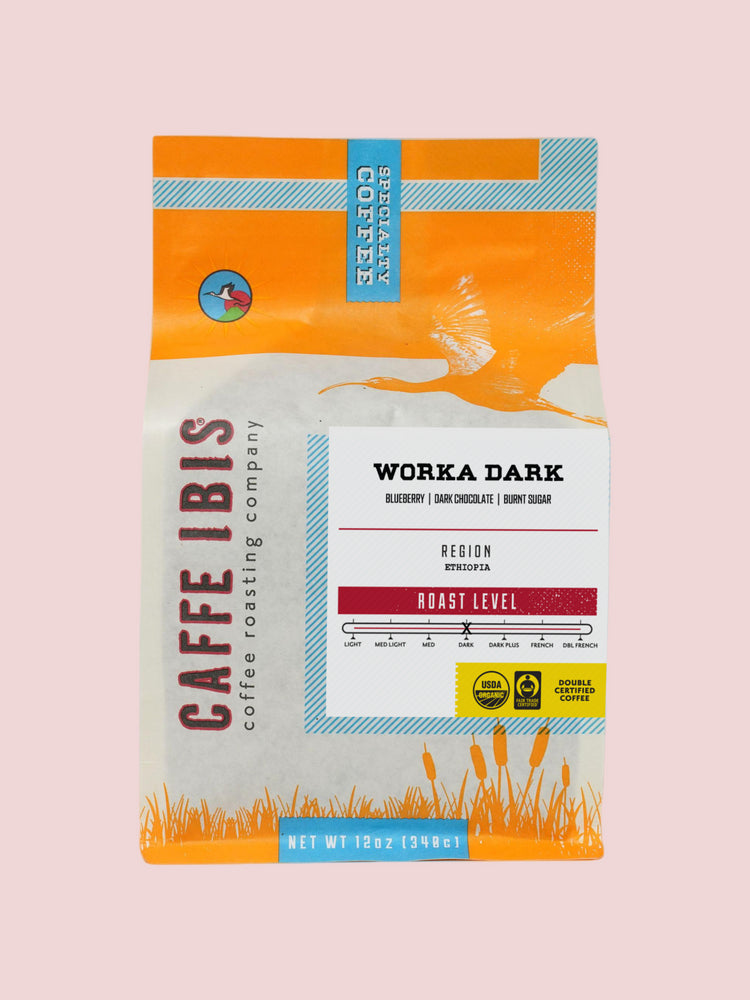 Caffe Ibis Organic Worka Dark in an orange twelve ounce bag; front view.